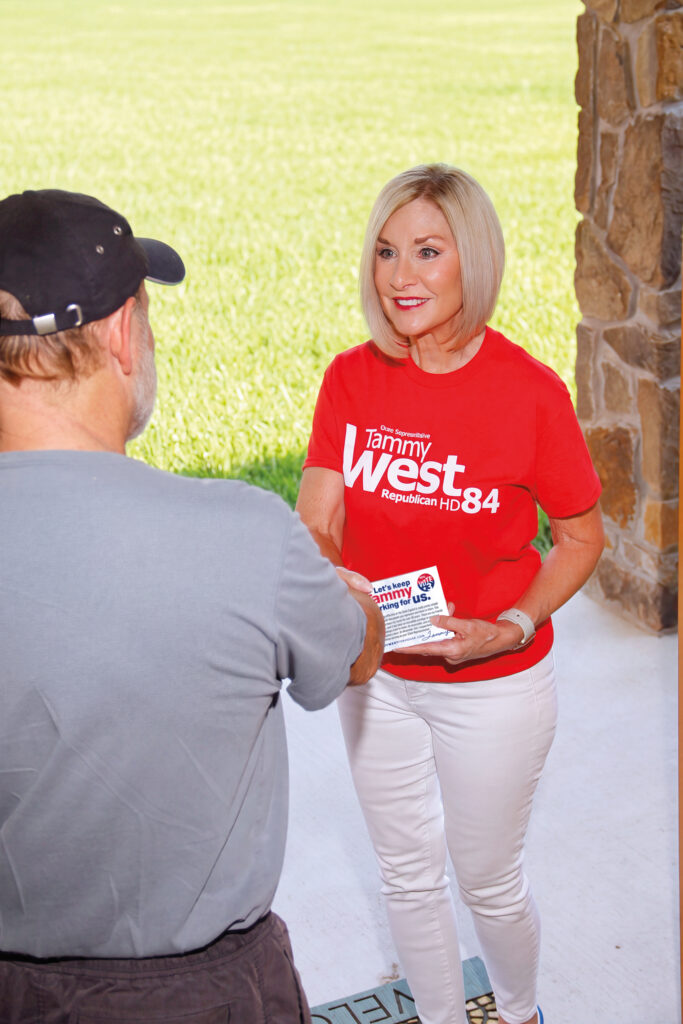 Tammy West greeting a constituent while campaigning door to door