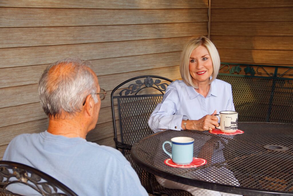 Tammy West visiting with a constituent over coffee